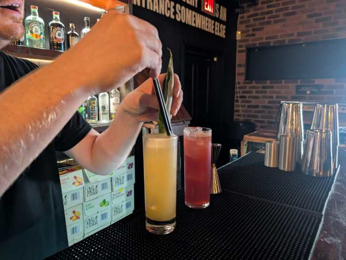 Two cocktails on a bar